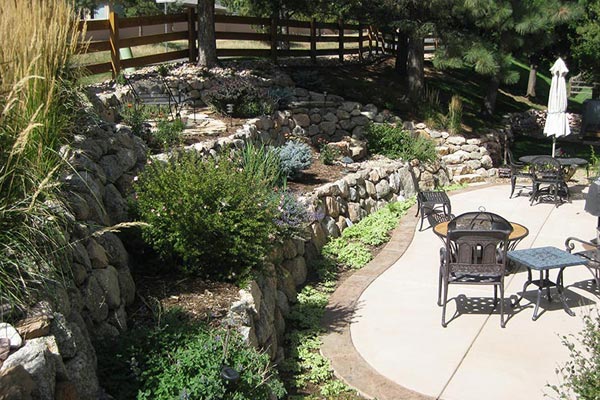 Backyard landscape design project with tiered retaining walls. Backyard landscape design project with tiered retaining walls.