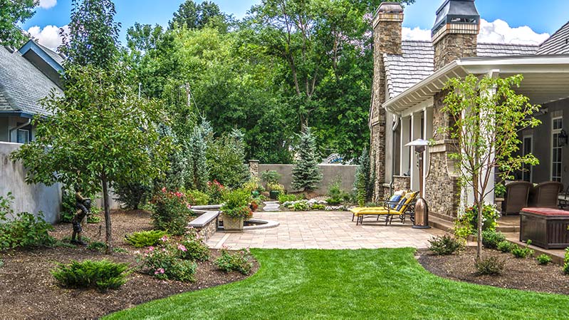 Broadmoor paver patio with integrated water feature. Broadmoor paver patio with integrated water feature.