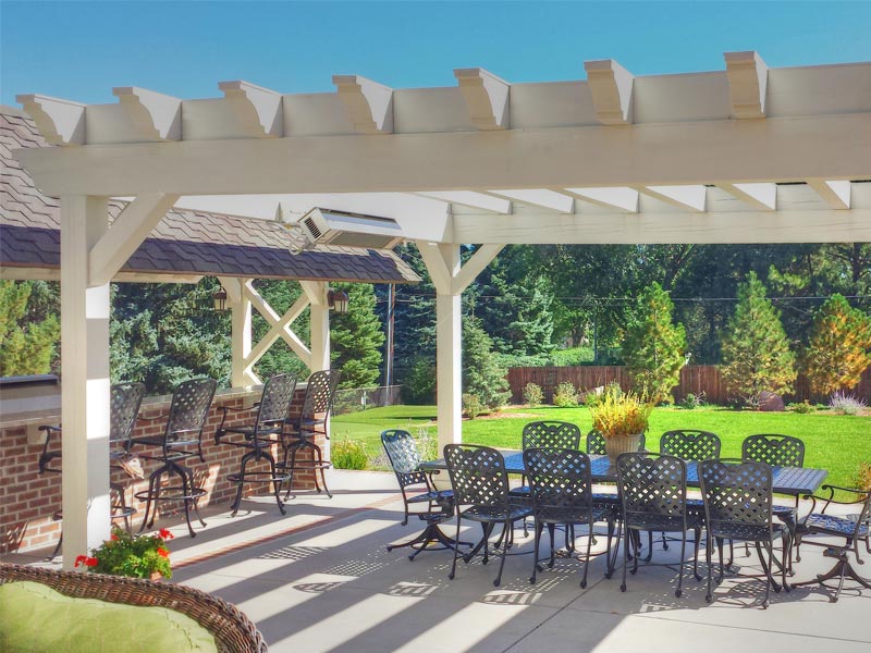 Outdoor living area with pergola, grill, and bar in the Broadmoor.