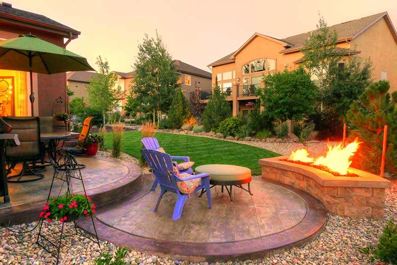 This natural gas fire pit is constructed of manufactured block and is a perfect fit for this smaller patio space. 