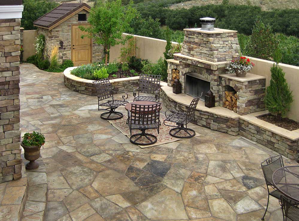 Courtyard with a flagstone patio and a custom wood burning fireplace.