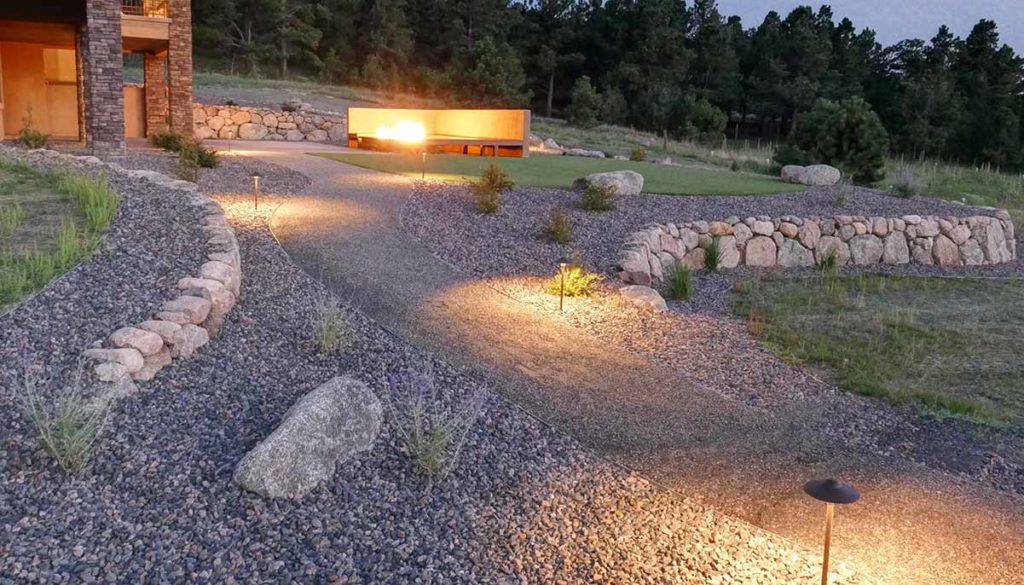Outdoor lighting on a path to the backyard patio.